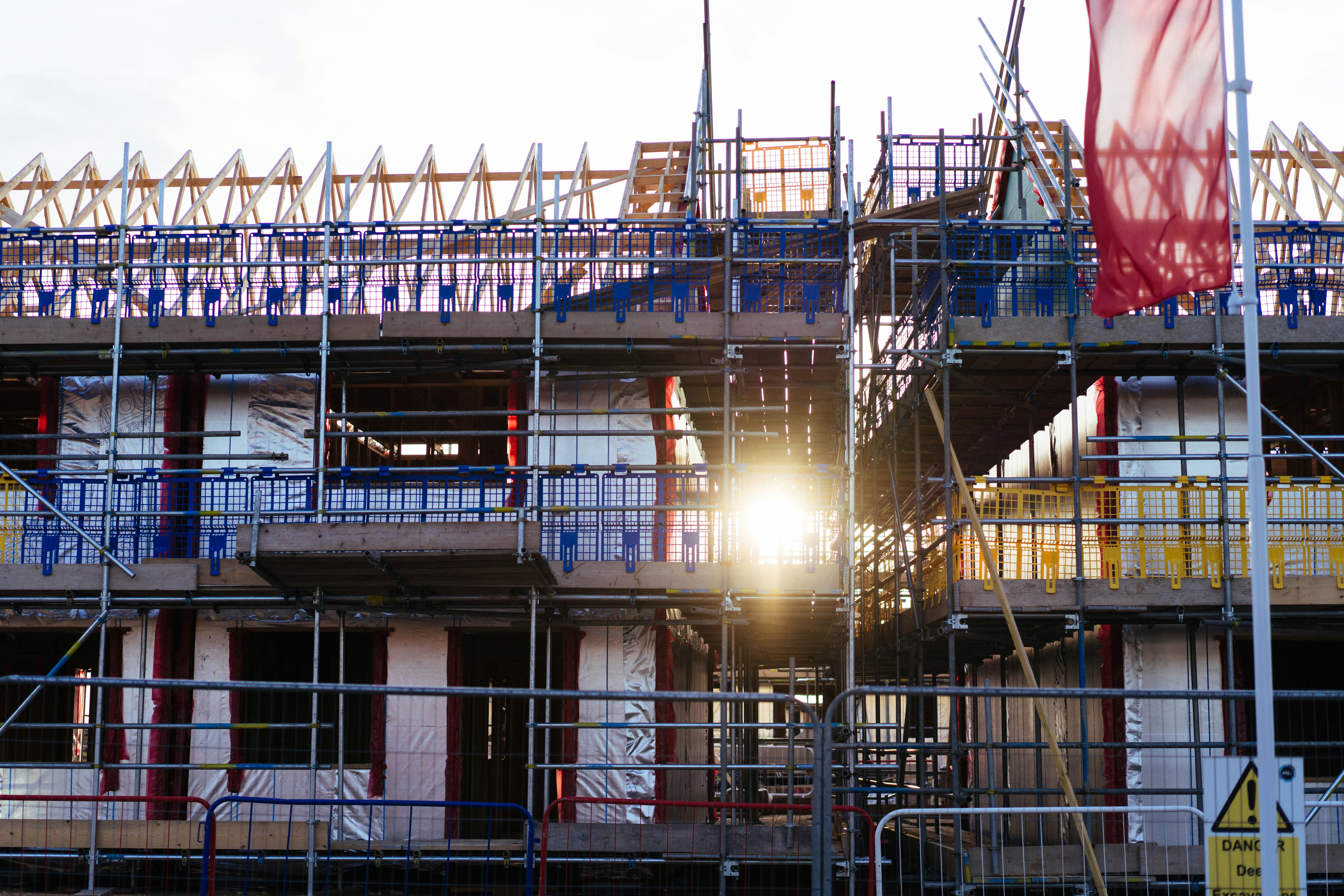 Residential construction site with scaffolding and natural light